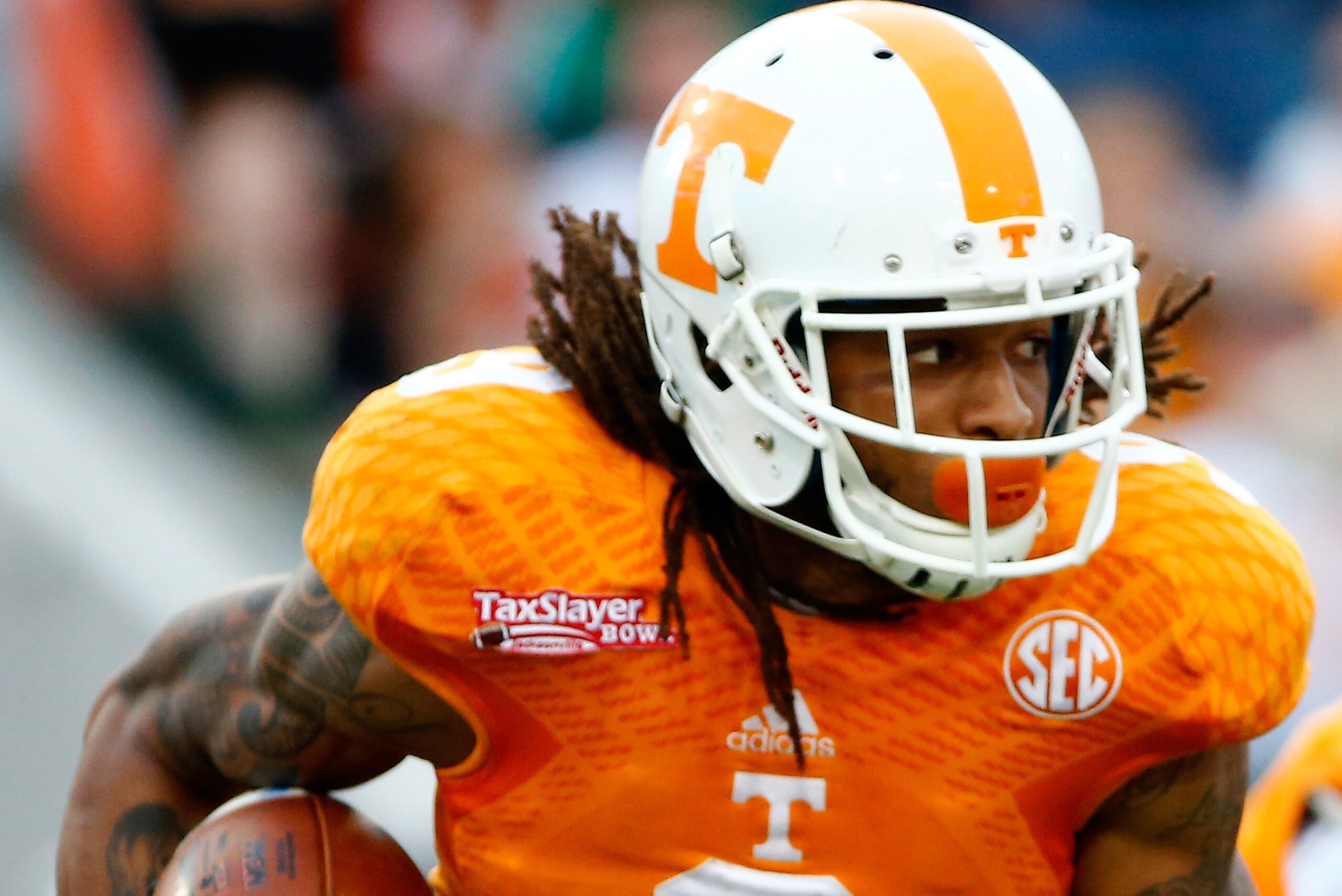 JACKSONVILLE, FL - JANUARY 02:  Von Pearson #9 of the Tennessee Volunteers rushes for yardage during the TaxSlayer Bowl against the Iowa Hawkeyes at EverBank Field on January 2, 2015 in Jacksonville, Florida.  (Photo by Sam Greenwood/Getty Images)