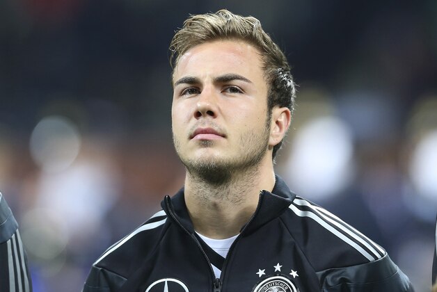 Germany midfielder Mario Gotze stands prior to the start of a friendly soccer match between Italy and Germany at the San Siro  stadium in Milan, Italy, Friday, Nov. 15, 2013. (AP Photo/Antonio Calanni)