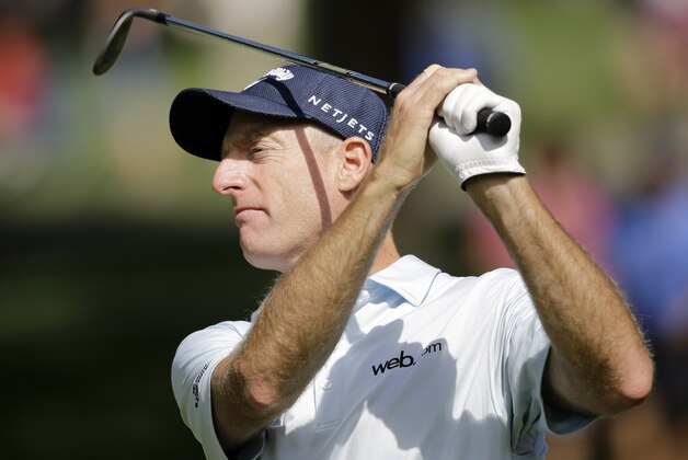 Jim Furyk hits from the fairway to the 11th green during the second round of the Bridgestone Invitational golf tournament at Firestone Country Club, Friday, Aug. 7, 2015, in Akron, Ohio. (AP Photo/Tony Dejak)