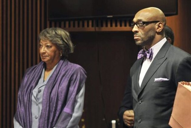 FILE - In this Jan. 21, 2014 file photo, former NFL football star, Irving Fryar, right, and his mother Allene McGhee appear before Judge James W. Palmer in Burlington County Superior Court in Mount Holly, N.J.  Fryar faces a five-year sentence under a plea deal, and his mother, Allene McGhee, has been offered a three-year prison sentence, according to the state attorney general’s office, which is prosecuting the case. Fryar and his mother were indicted last fall on charges they conspired to steal more than $690,000 through a mortgage scam run by William Barksdale, who was sentenced in February to 20 months in federal prison after pleading guilty to conspiracy to commit wire fraud. (AP Photo/Burlington County Times, Dennis McDonald, Pool)