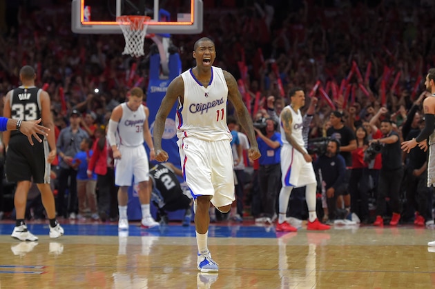 Los Angeles Clippers guard Jamal Crawford, center, celebrates along with forward Blake Griffin, second from left, and forward Matt Barnes, second from right, as San Antonio Spurs center Boris Diaw, left, of France, and forward Marco Belinelli, of Italy, watch after they defeated the Spurs in Game 7 in a first-round NBA basketball playoff series, Saturday, May 2, 2015, in Los Angeles. The Clippers won 111-109. (AP Photo/Mark J. Terrill)