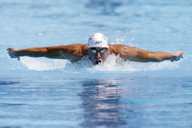 Michael Phelps competes in the preliminary round of the men's 200 meter butterfly at the U.S. nationals of swimming, Friday, Aug. 7, 2015, in San Antonio. (AP Photo/Eric Gay)