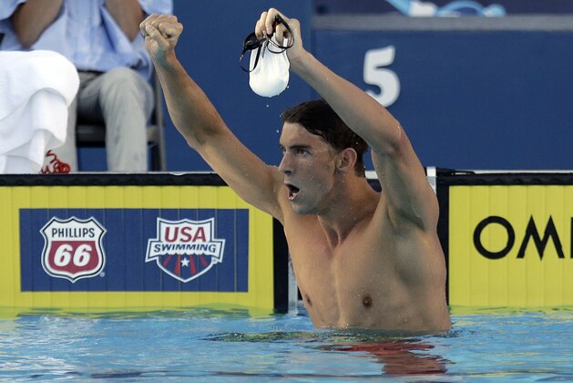 Michael Phelps celebrates his win in the finals of the 200-meter butterfly at the U.S. swimming nationals Friday, Aug. 7, 2015, in San Antonio. (AP Photo/Eric Gay)