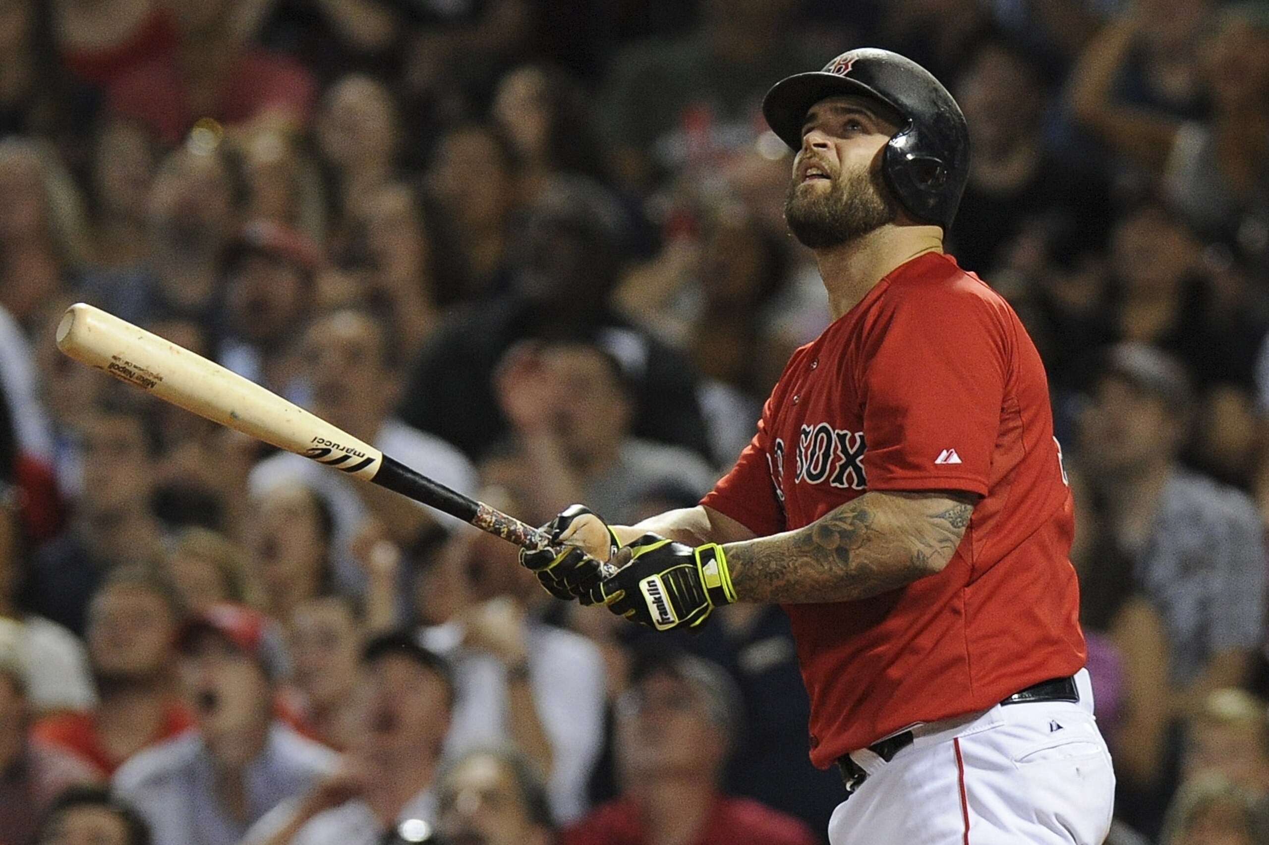Jul 31, 2015; Boston, MA, USA; Boston Red Sox first baseman Mike Napoli (12) watches his home run land in the green monster seats during the seventh inning against the Tampa Bay Rays at Fenway Park. Mandatory Credit: Bob DeChiara-USA TODAY Sports