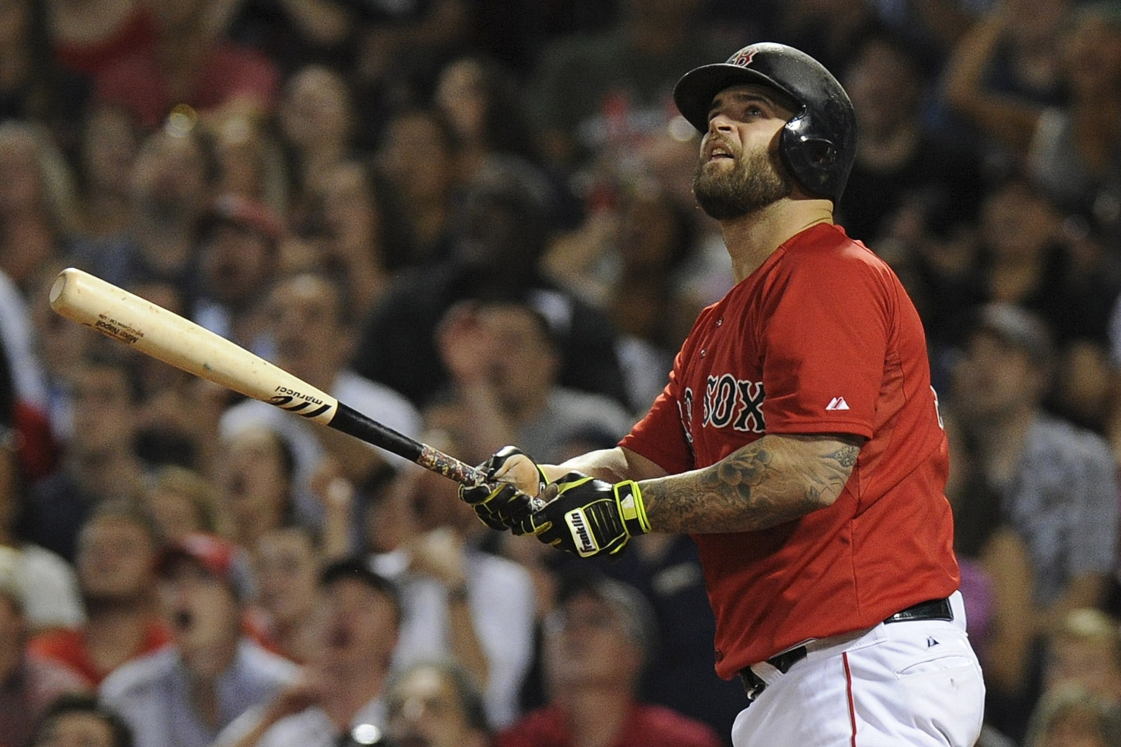 Jul 31, 2015; Boston, MA, USA; Boston Red Sox first baseman Mike Napoli (12) watches his home run land in the green monster seats during the seventh inning against the Tampa Bay Rays at Fenway Park. Mandatory Credit: Bob DeChiara-USA TODAY Sports
