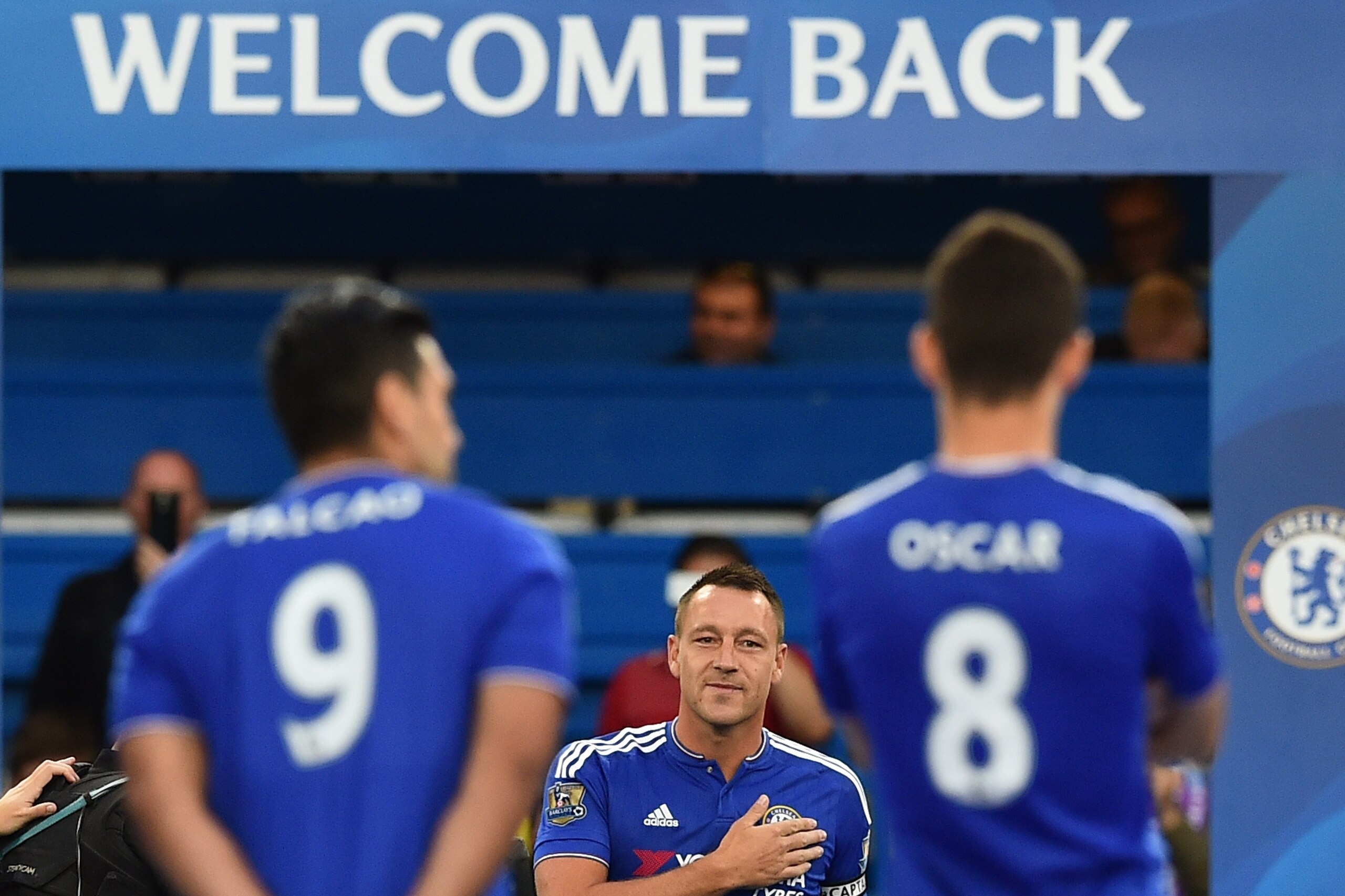 Chelsea's English defender John Terry (C) walks onto the pitch before the start of the pre-season friendly football match between Chelsea and Fiorentina at Stamford Bridge in London on August 5, 2015.  AFP PHOTO / BEN STANSALLRESTRICTED TO EDITORIAL USE. NO USE WITH UNAUTHORIZED AUDIO, VIDEO, DATA, FIXTURE LISTS, CLUB/LEAGUE LOGOS OR LIVE SERVICES. ONLINE IN-MATCH USE LIMITED TO 45 IMAGES, NO VIDEO EMULATION. NO USE IN BETTING, GAMES OR SINGLE CLUB/LEAGUE/PLAYER PUBLICATIONS.        (Photo credit should read BEN STANSALL/AFP/Getty Images)
