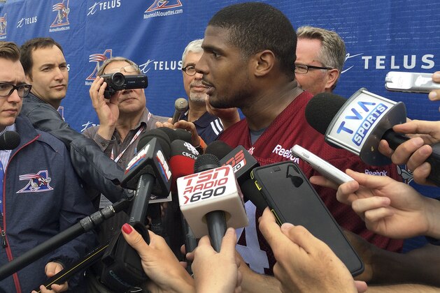 Montreal Alouettes defensive lineman Michael Sam speaks to reporters after returning to practice with the Canadian Football League team Monday, June 29, 2015, in Montreal. Sam, the first openly gay player drafted by an NFL team,  could not make the roster of the St. Louis Rams and signed with Montreal. He left the Alouettes for what he said were personal reasons, but returned to the team this week. (AP Photo/Jimmy Golen)