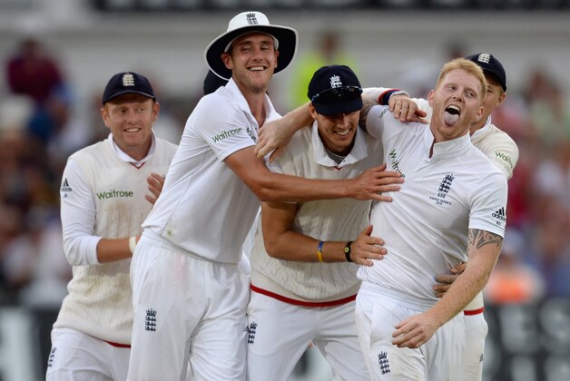 NOTTINGHAM, ENGLAND - AUGUST 07:  Ben Stokes of England celebrates with teammates Stuart Broad and Steven Finn after dismissing Mitchell Johnson of Australia during day two of the 4th Investec Ashes Test match between England and Australia at Trent Bridge on August 7, 2015 in Nottingham, United Kingdom.  (Photo by Gareth Copley/Getty Images)