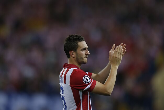 Atletico's Koke applauds to Atletico supporters at the end of the Champions League quarterfinal second leg soccer match between Atletico Madrid and FC Barcelona at the Vicente Calderon stadium in Madrid, Spain, Wednesday, April 9, 2014. (AP Photo/Andres Kudacki)