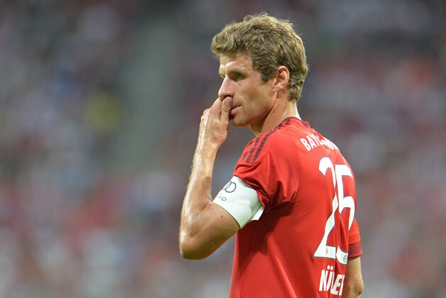 Munich's Thomas Mueller during  their friendly soccer match between FC Bayern and AC Milan, in the Allianz Arena stadium in Munich, southern Germany, Tuesday, Aug. 4, 2015. (AP Photo/Kerstin Joensson)