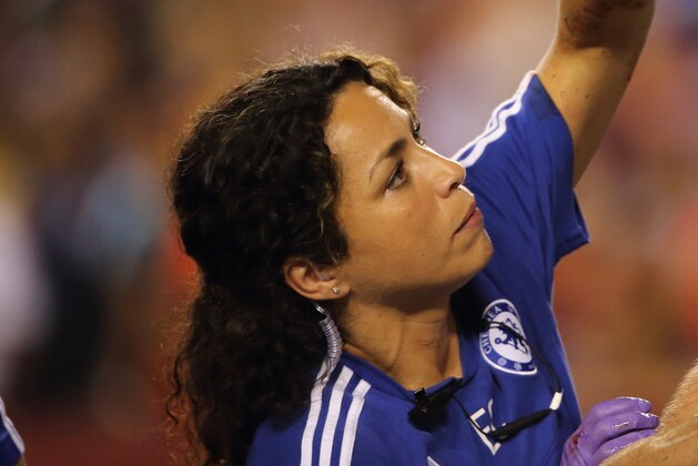 LANDOVER, MD - JULY 28:  Chelsea first-team doctor Eva Carneiro attends to Gary Cahill of Chelsea who suffered a bloody nose following scoring the goal which tied the game 2-2 during the International Champions Cup match between Barcelona and Chelsea at FedExField on July 28, 2015 in Landover, Maryland.  (Photo by Matthew Ashton - AMA/Getty Images)