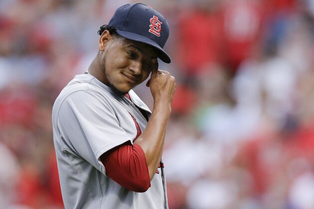 St. Louis Cardinals starting pitcher Carlos Martinez reacts after the third inning of a baseball game against the Cincinnati Reds, Wednesday, Aug. 5, 2015, in Cincinnati. (AP Photo/John Minchillo)