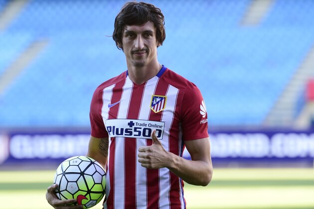 Atletico de Madrid's new football signing Montenegrin Stefan Savic poses with the ball during his presentation at Vicente Calderon stadium in Madrid on July 27, 2015.  AFP PHOTO / JAVIER SORIANO        (Photo credit should read JAVIER SORIANO/AFP/Getty Images)