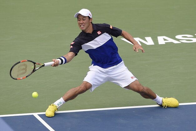 Kei Nishikori, of Japan, returns the ball against Marin Cilic, of Croatia, at the Citi Open tennis tournament, Saturday, Aug. 8, 2015, in Washington. (AP Photo/Nick Wass)