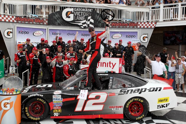 Aug 8, 2015; Watkins Glen, NY, USA; Xfinity Series driver Joey Logano (12) celebrates a victory during the Zippo 200 at Watkins Glen International. Mandatory Credit: Timothy T. Ludwig-USA TODAY Sports