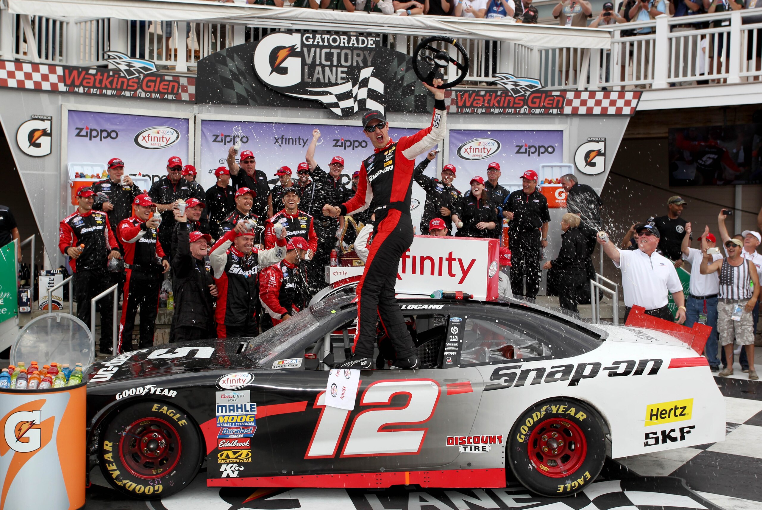 Aug 8, 2015; Watkins Glen, NY, USA; Xfinity Series driver Joey Logano (12) celebrates a victory during the Zippo 200 at Watkins Glen International. Mandatory Credit: Timothy T. Ludwig-USA TODAY Sports Aug 8, 2015; Watkins Glen, NY, USA; Xfinity Series driver Joey Logano (12) celebrates a victory during the Zippo 200 at Watkins Glen International. Mandatory Credit: Timothy T. Ludwig-USA TODAY Sports