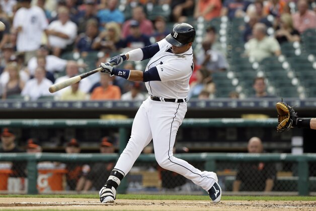 Detroit Tigers designated hitter Victor Martinez connects for a two-run home run during the first inning of a baseball game against the Baltimore Orioles, Friday, July 17, 2015, in Detroit. (AP Photo/Carlos Osorio)