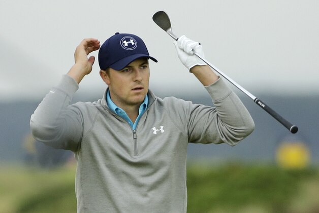 FILE - In this July 20, 2015, file photo, Jordan Spieth misses reacts after missing with a chip shot on the 15th hole during the final round at the British Open Golf Championship at the Old Course in St. Andrews, Scotland. Spieth, whose Grand Slam bid ended at the British Open by one shot, wants to treat his final six events of the season as if he were starting over. He plays the Bridgestone Invitational this week in Akron, Ohio, and next week at the PGA Championship can become the first player to sweep the American majors.(AP Photo/David J. Phillip, File)