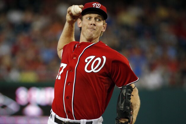 Washington Nationals starting pitcher Stephen Strasburg throws during the fourth inning of a baseball game against the Colorado Rockies at Nationals Park, Saturday, Aug. 8, 2015, in Washington. (AP Photo/Alex Brandon)