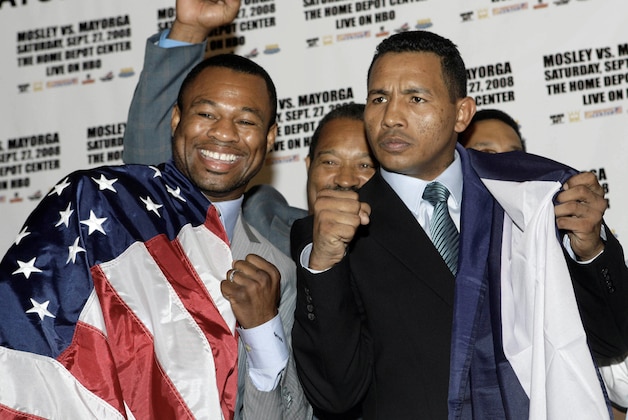 Shane Mosley, left,  poses with  Ricardo Mayorga, from  Nicaragua, during a news conference  in Los Angeles, Thursday, Aug. 7,  2008. They announced that they will fight as light middleweights in The Home Depot Center in Carson, Calif., on Saturday, Sep. 27.  (AP Photo/Nick Ut)