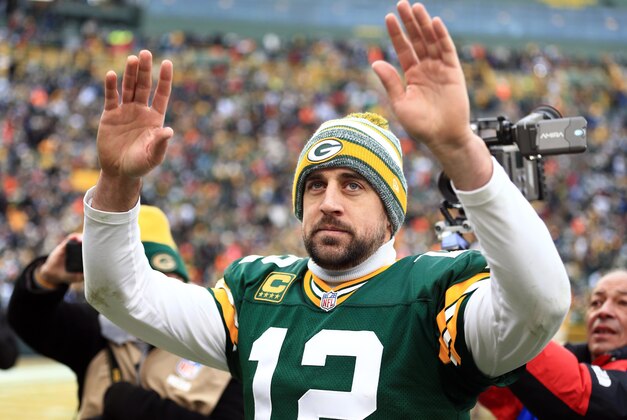 Jan 11, 2015; Green Bay, WI, USA; Green Bay Packers quarterback Aaron Rodgers (12) waves to the crowd after the 2014 NFC Divisional playoff football game against the Dallas Cowboys at Lambeau Field. Mandatory Credit: Andrew Weber-USA TODAY Sports