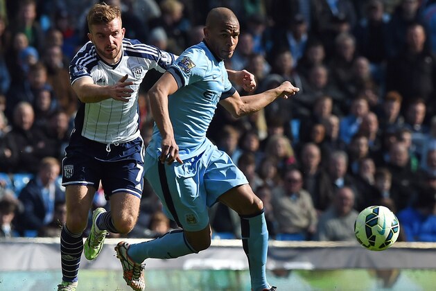 West Bromwich Albion's English-born Scottish midfielder James Morrison (L) competes with Manchester City's Brazilian midfielder Fernando during the English Premier League football match between Manchester City and West Bromwich Albion at the Etihad Stadium in Manchester, north west England, on March 21, 2015. Manchester City won the match 3-0. AFP PHOTO / PAUL ELLIS

RESTRICTED TO EDITORIAL USE. NO USE WITH UNAUTHORIZED AUDIO, VIDEO, DATA, FIXTURE LISTS, CLUB/LEAGUE LOGOS OR LIVE SERVICES. ONLINE IN-MATCH USE LIMITED TO 45 IMAGES, NO VIDEO EMULATION. NO USE IN BETTING, GAMES OR SINGLE CLUB/LEAGUE/PLAYER PUBLICATIONS.        (Photo credit should read PAUL ELLIS/AFP/Getty Images)