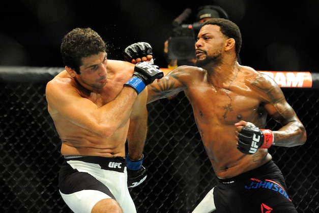 Aug 8, 2015; Nashville, TN, USA; Michael Johnson (red gloves) fights against Beneil Dariush (blue gloves) during UFC Fight Night at Bridgestone Arena. Mandatory Credit: Joshua Lindsey-USA TODAY Sports