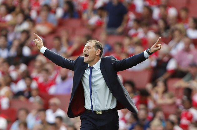West Ham's Slaven Bilic celebrates after his team won the English Premier League soccer match between Arsenal and West Ham at the Emirates stadium in London, Sunday, Aug. 9, 2015.(AP Photo/Frank Augstein)