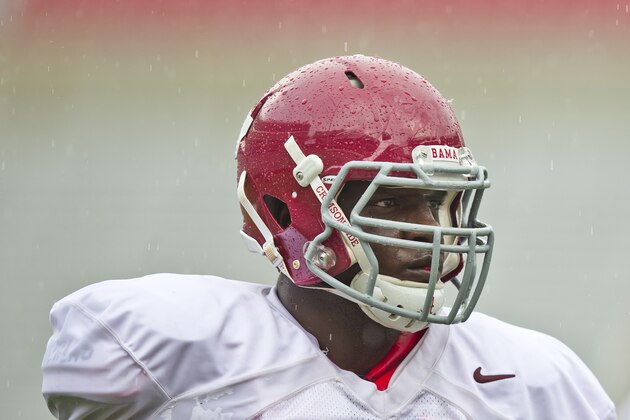 Alabama offensive linesman Cam Robinson (74) sets up for the next practice drill during an NCAA college football practice at Bryant–Denny Stadium on Sunday, Aug. 3, 2014, in Tuscaloosa, Ala. (AP Photo/Brynn Anderson)