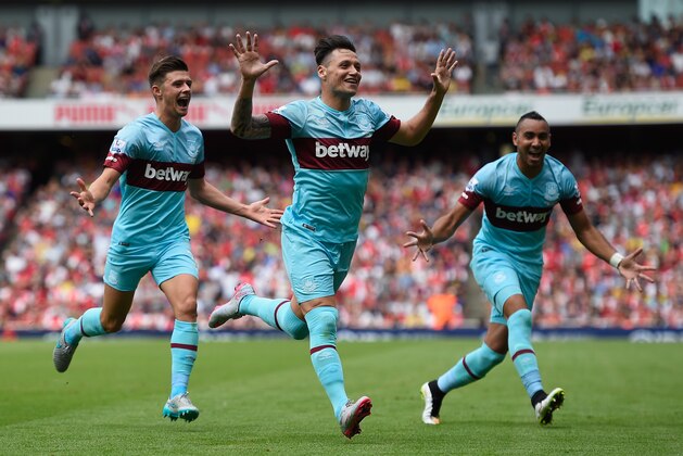 LONDON, ENGLAND - AUGUST 09:  Mauro Zarate of West Ham United (C) celebrates with team mates as he scores their second goal during the Barclays Premier League match between Arsenal and West Ham United at the Emirates Stadium on August 9, 2015 in London, England.  (Photo by Mike Hewitt/Getty Images)