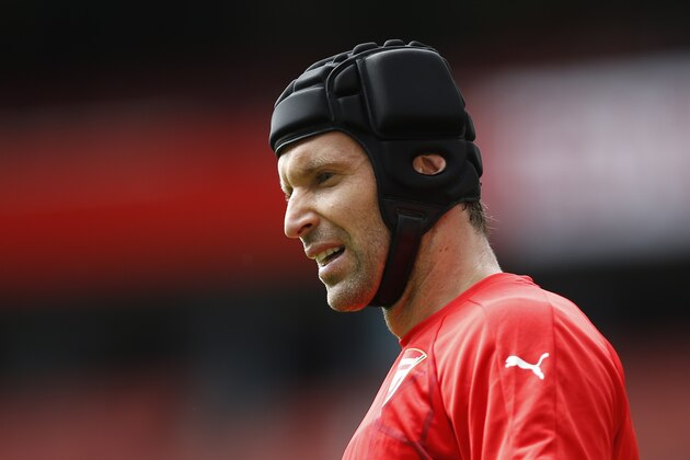 Arsenal's Czech goalkeeper Petr Cech warms up before the start of the English Premier League football match between Arsenal and West Ham United at the Emirates Stadium in London on August 9, 2015. AFP PHOTO / ADRIAN DENNIS

RESTRICTED TO EDITORIAL USE. No use with unauthorized audio, video, data, fixture lists, club/league logos or 'live' services. Online in-match use limited to 75 images, no video emulation. No use in betting, games or single club/league/player publications.        (Photo credit should read ADRIAN DENNIS/AFP/Getty Images)