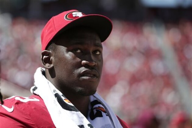 FILE - In this Aug. 17, 2014, file photo, San Francisco 49ers linebacker Aldon Smith (99) watches from the sideline during the second half of an NFL preseason football game against the Denver Broncos in Santa Clara, Calif. Aldon Smith has been suspended for nine games by the NFL after a series of off-field legal issues. A statement Friday, Aug. 29, 2014, from the league said Smith had violated the NFL’s substance abuse and personal conduct policies. (AP Photo/Marcio Jose Sanchez, File)