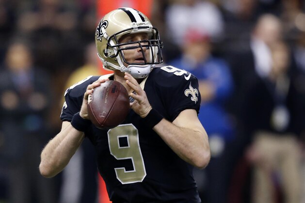New Orleans Saints quarterback Drew Brees (9) drops back to pass in the first half of an NFL football game against the Atlanta Falcons in New Orleans, Sunday, Dec. 21, 2014. (AP Photo/Rogelio Solis)