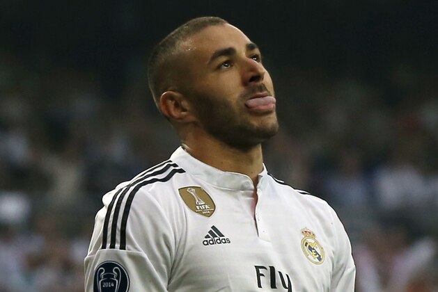 Real Madrid's Karim Benzema grimaces during the Champions League second leg semifinal soccer match between Real Madrid and Juventus, at the Santiago Bernabeu stadium in Madrid, Wednesday, May 13, 2015. (AP Photo/Daniel Ochoa de Olza)