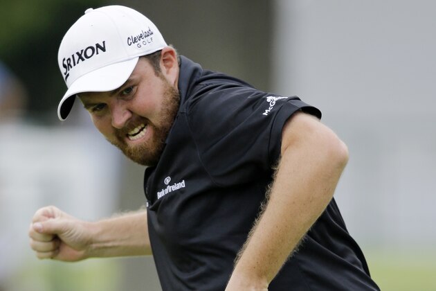 Shane Lowry, from Ireland, pumps his fist as he watches his birdie putt on the 18th hole to win the Bridgestone Invitational golf tournament at Firestone Country Club, Sunday, Aug. 9, 2015, in Akron, Ohio. (AP Photo/Tony Dejak)