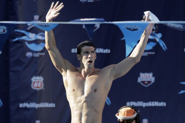 Michael Phelps celebrates his win in the finals of the men's 200-meter individual medley at the the U.S. swimming nationals, Sunday, Aug. 9, 2015, in San Antonio. (AP Photo/Eric Gay)