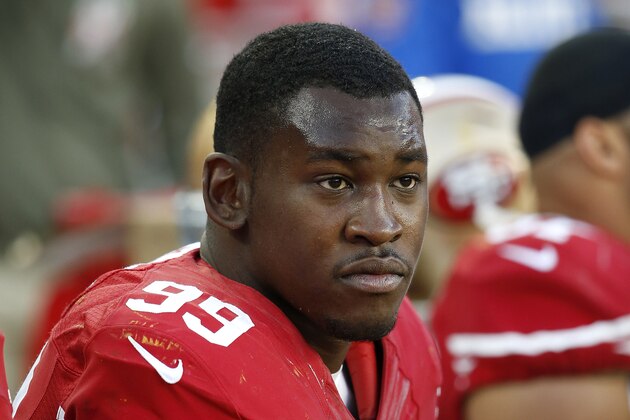 FILE - In this Nov. 23, 2014, file photo, San Francisco 49ers linebacker Aldon Smith sits on the bench during the second half of an NFL football game against the Washington Redskins in Santa Clara, Calif. Smith received second chance after second chance with the 49ers, who parted ways with their troubled linebacker Friday, Aug. 7, 2015, following his fifth run-in with the law. Santa Clara police arrested Smith on Thursday, and accused him of drunken driving, hit and run and vandalism. (AP Photo/Tony Avelar, File)