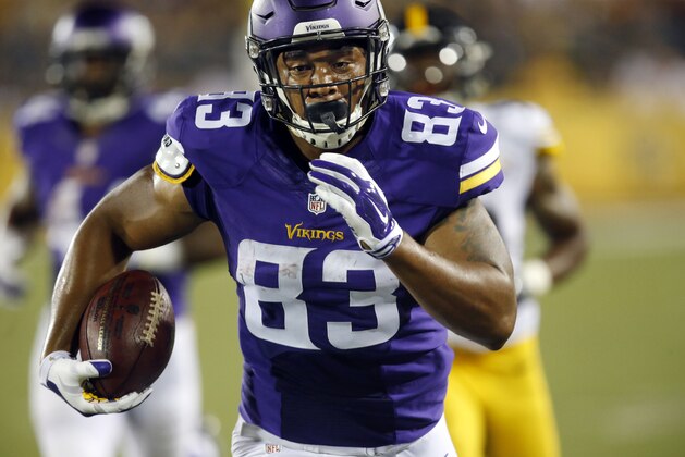 Minnesota Vikings tight end MyCole Pruitt (83) heads to the end zone for a touchdown after taking a pass from quarterback Minnesota Vikings quarterback Mike Kafka (4) during the first half of an NFL preseason football game against the Pittsburgh Steelers in Canton, Ohio,  Sunday, Aug. 9, 2015. (AP Photo/Tom E. Puskar)