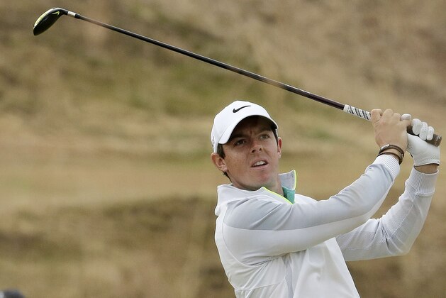 FILE - In this Thursday, June 18, 2015 file photo, Rory McIlroy, of Northern Ireland, watches his tee shot on the 10th hole during the first round of the U.S. Open golf tournament at Chambers Bay in University Place, Wash.  Rory McIlroy posted two videos on Instagram that suggest he might be able to return for the PGA Championship, Thursday, Aug. 6, 2015. (AP Photo/Charlie Riedel, File)