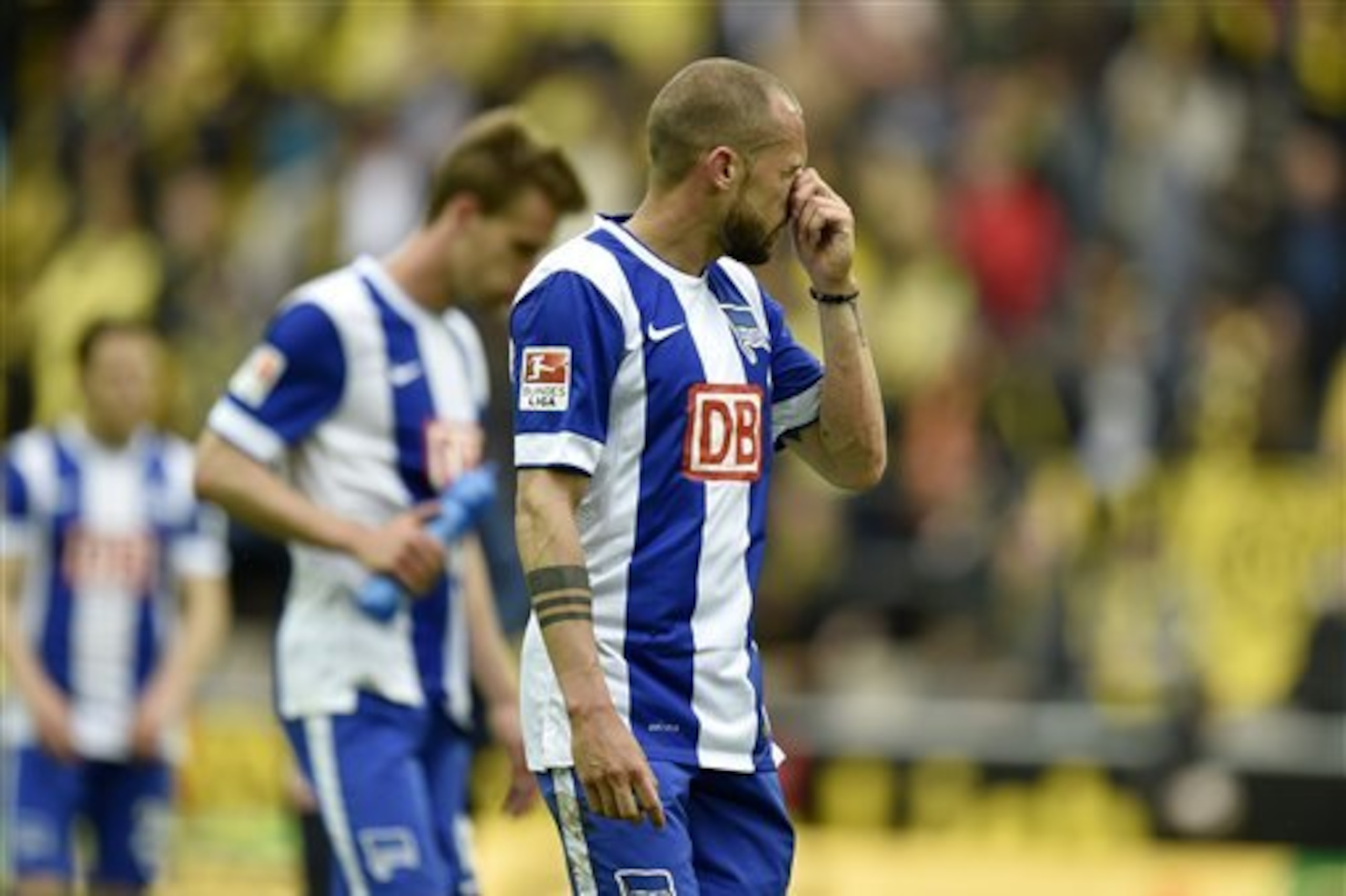 Berlin's John Heitinga from the Netherlands levaes the pitch disappointed after losing the German first division Bundesliga soccer match between Borussia Dortmund and Hertha BSC Berlin in Dortmund, Germany, Saturday, May 9, 2015. Dortmund defeated Berlin with 2-0. (AP Photo/Martin Meissner) Berlin's John Heitinga from the Netherlands levaes the pitch disappointed after losing the German first division Bundesliga soccer match between Borussia Dortmund and Hertha BSC Berlin in Dortmund, Germany, Saturday, May 9, 2015. Dortmund defeated Berlin with 2-0. (AP Photo/Martin Meissner)