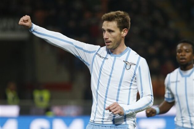 Lazio’s Lucas Rodrigo Biglia celebrates after scoring during an Italian Cup, quarterfinal match, between AC Milan and Lazio, at the San Siro stadium in Milan, Italy, Tuesday, Jan. 27 , 2015. (AP Photo/Luca Bruno)