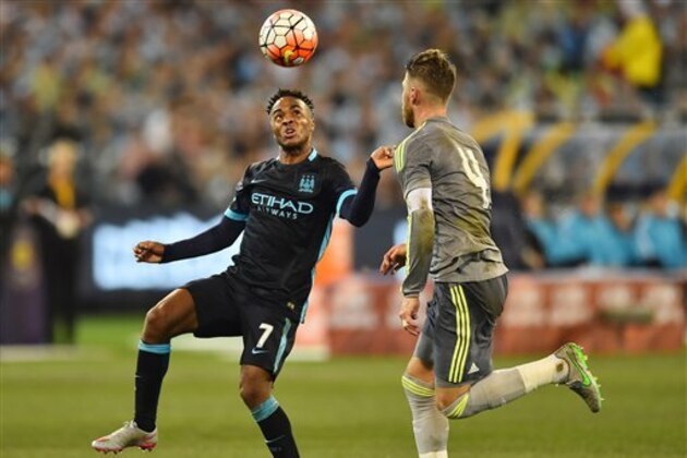 Raheem Sterling, left, of Manchester City and Sergio Ramos of Real Madrid contest for the ball during their International Championship Cup soccer match in Melbourne, Australia, Friday, July 24, 2015. (AP Photo/Theo Karanikos)