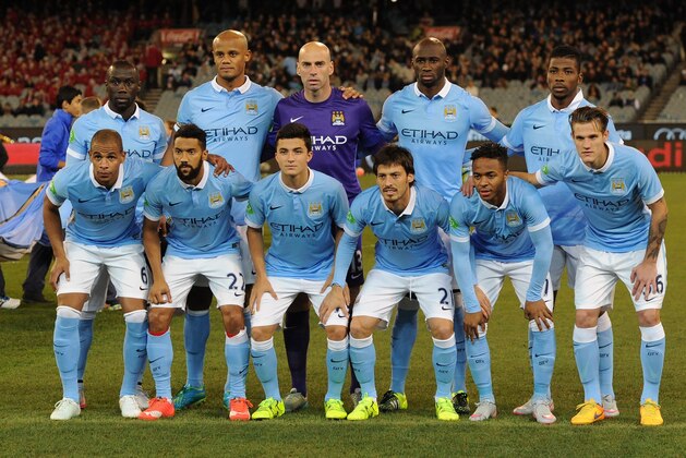 Manchester City players pose for a photo before the International Champions Cup football match against Italian side AS Roma in Melbourne on July 21, 2015. AFP PHOTO / Mal FAIRCLOUGH -- IMAGE RESTRICTED TO EDITORIAL USE - STRICTLY NO COMMERCIAL USE        (Photo credit should read MAL FAIRCLOUGH/AFP/Getty Images)
