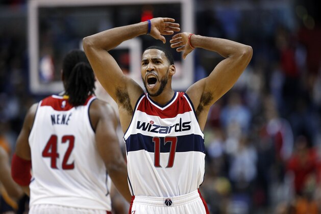 Washington Wizards guard Garrett Temple (17) celebrates in the overtime of the Wizards' NBA basketball game against the Indiana Pacers, Wednesday, Nov. 5, 2014, in Washington. The Wizards won 96-94. (AP Photo/Alex Brandon)