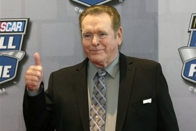Former NASCAR driver Buddy Baker flashes a thumbs-up to the media as he arrives for the induction of his father, Buck Baker, into the NASCAR Hall of Fame, Friday Feb. 8, 2013, in Charlotte, N.C. (AP Photo/Bob Leverone)