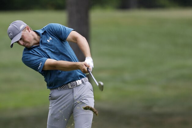Jordan Spieth hits from the fairway on the sixth hole during the final round of the Bridgestone Invitational golf tournament at Firestone Country Club, Sunday, Aug. 9, 2015, in Akron, Ohio. (AP Photo/Tony Dejak)