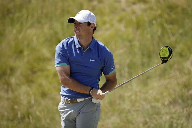 FILE - In this June 20, 2015, file photo, Rory McIlroy, of Northern Ireland, watches his tee shot on the seventh hole during the third round of the U.S. Open golf tournament at Chambers Bay in University Place, Wash. McIlroy, he No. 1 player in golf, already has three wins in 2015, including a World Golf Championship, and he has finished in the top 10 at both majors. Halfway through the year, however, McIlroy is playing second fiddle. (AP Photo/Charlie Riedel, File)