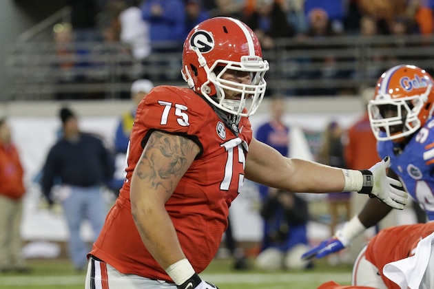Georgia offensive tackle Kolton Houston (75) looks to block in a play against Florida during the second half of an NCAA college football game in Jacksonville, Fla., Saturday, Nov. 1, 2014. Florida won 38-20. (AP Photo/John Raoux)