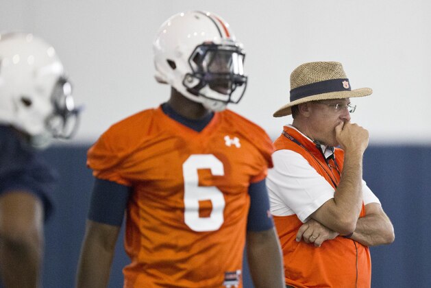 Auburn head coach Gus Malzahn, right, and quarterback Jeremy Johnson watch drills during NCAA college football practice, Tuesday, Aug. 4, 2015, in Auburn, Ala. (AP Photo/Brynn Anderson)