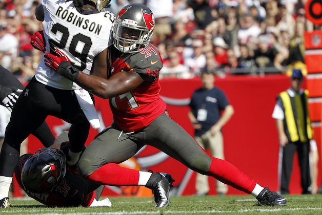 Dec 28, 2014; Tampa, FL, USA; Tampa Bay Buccaneers outside linebacker Lavonte David (54) tackles New Orleans Saints running back Khiry Robinson (29) during the second quarter at Raymond James Stadium. Mandatory Credit: Kim Klement-USA TODAY Sports